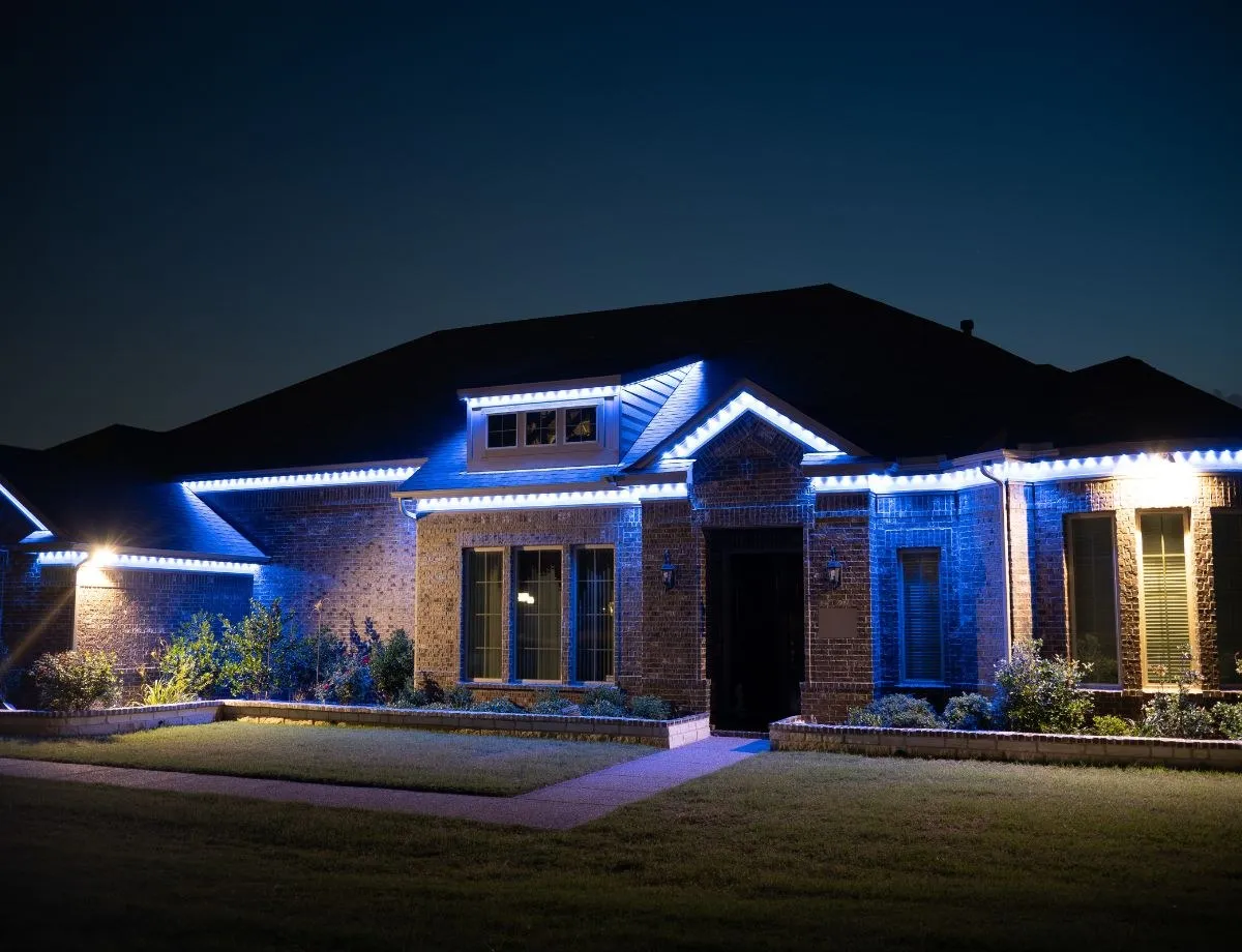 Home with blue roofline lighting for game day